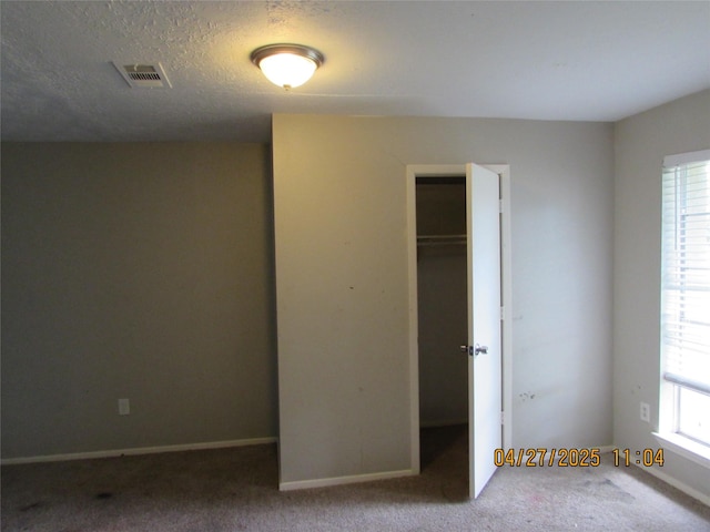 16114 Forest Bend Ave, Friendswood, TX 77546 - unfurnished bedroom featuring carpet floors, a closet, and baseboards