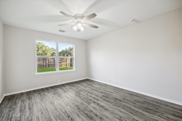 10410 Caribou Cv, Missouri City, TX 77459 - empty room featuring dark wood-type flooring, baseboards, and ceiling fan