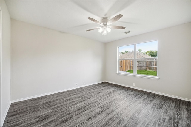 10410 Caribou Cv, Missouri City, TX 77459 - unfurnished room with dark wood-style flooring, baseboards, and a ceiling fan