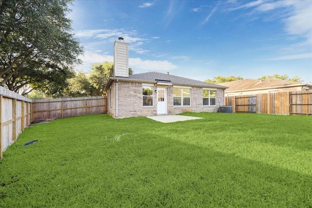 10410 Caribou Cv, Missouri City, TX 77459 - rear view of house with a chimney, central air condition unit, and brick siding