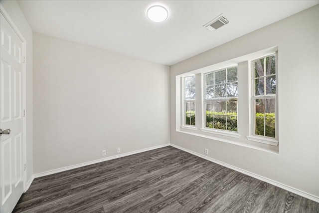 10410 Caribou Cv, Missouri City, TX 77459 - unfurnished bedroom featuring dark wood-style floors and baseboards