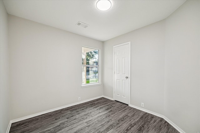 10410 Caribou Cv, Missouri City, TX 77459 - empty room with dark wood finished floors and baseboards
