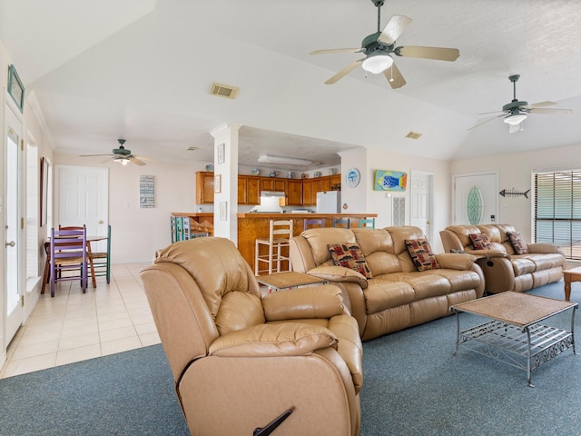 779 County Road 257, Matagorda, TX 77457 - living room featuring lofted ceiling, ceiling fan, light tile patterned flooring, and baseboards