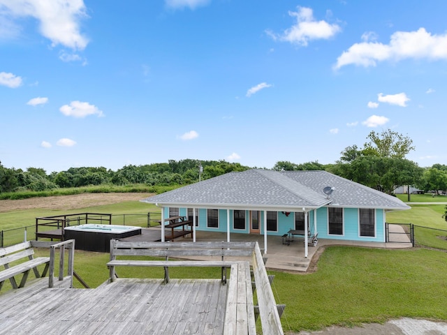 779 County Road 257, Matagorda, TX 77457 - wooden terrace with an outdoor hot tub