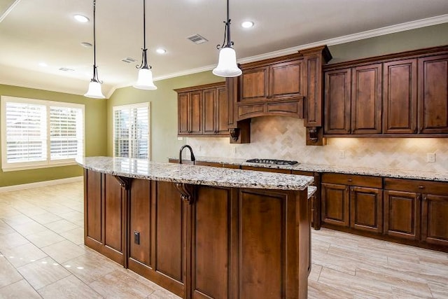 17218 Meek Pass Dr, Cypress, TX 77433 - kitchen featuring ornamental molding, backsplash, light stone countertops, pendant lighting, and recessed lighting