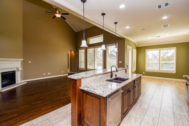 17218 Meek Pass Dr, Cypress, TX 77433 - kitchen featuring a sink, dishwasher, open floor plan, crown molding, and ceiling fan