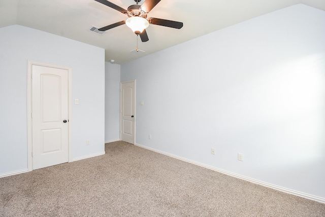 17218 Meek Pass Dr, Cypress, TX 77433 - unfurnished room with light carpet, lofted ceiling, baseboards, and a ceiling fan