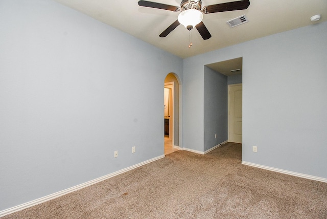 17218 Meek Pass Dr, Cypress, TX 77433 - unfurnished room with arched walkways, carpet, ceiling fan, and baseboards