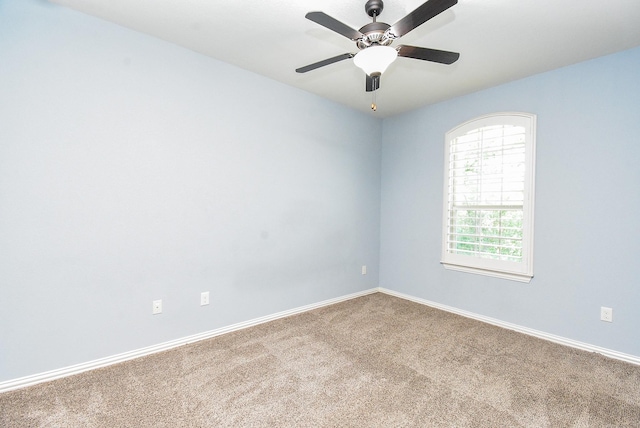 17218 Meek Pass Dr, Cypress, TX 77433 - carpeted empty room with baseboards and ceiling fan