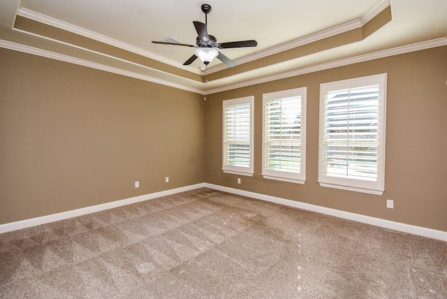 17218 Meek Pass Dr, Cypress, TX 77433 - empty room featuring a raised ceiling, crown molding, carpet, baseboards, and ceiling fan