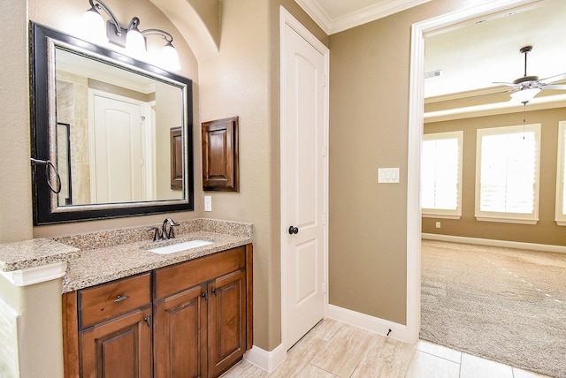 17218 Meek Pass Dr, Cypress, TX 77433 - bathroom with crown molding, vanity, baseboards, and a ceiling fan