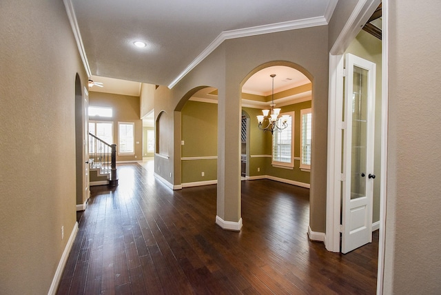 17218 Meek Pass Dr, Cypress, TX 77433 - entryway with dark wood finished floors, ornamental molding, arched walkways, baseboards, and a textured wall