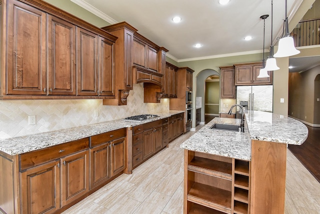 17218 Meek Pass Dr, Cypress, TX 77433 - kitchen featuring a sink, stainless steel appliances, open shelves, arched walkways, and ornamental molding