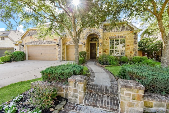 17218 Meek Pass Dr, Cypress, TX 77433 - view of front of property with stone siding, concrete driveway, and a garage