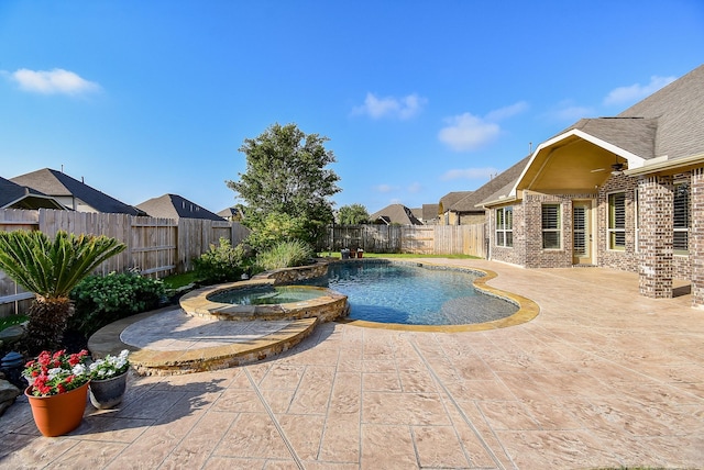 17218 Meek Pass Dr, Cypress, TX 77433 - view of pool with a pool with connected hot tub, a patio, a fenced backyard, and a residential view
