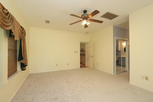 23302 Green Forest St, Hockley, TX 77447 - unfurnished bedroom with light carpet, baseboards, and ceiling fan