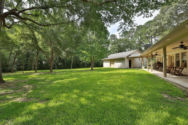 23302 Green Forest St, Hockley, TX 77447 - view of green lawn featuring ceiling fan and a patio
