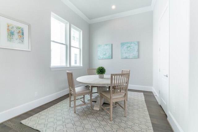 737 Bringhurst St, Houston, TX 77020 - dining space with wood finished floors, baseboards, and ornamental molding