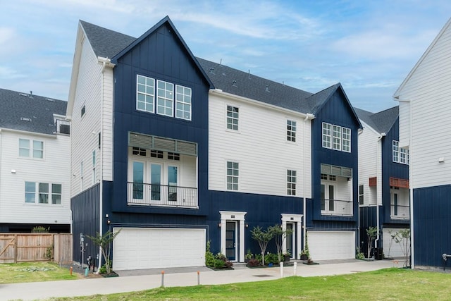 737 Bringhurst St, Houston, TX 77020 - view of front facade featuring board and batten siding and an attached garage