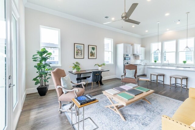 737 Bringhurst St, Houston, TX 77020 - living area with ornamental molding, ceiling fan, dark wood-type flooring, recessed lighting, and baseboards