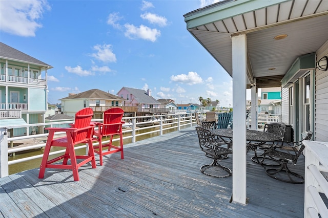 16703 Managua Way, Jamaica Beach, TX 77554 - wooden deck featuring a residential view and outdoor dining area