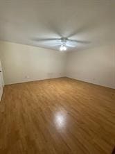 12633 Memorial Dr Unit 72, Houston, TX 77024 - empty room with wood finished floors and a ceiling fan