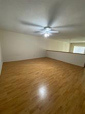 12633 Memorial Dr Unit 72, Houston, TX 77024 - bonus room with wood finished floors and ceiling fan