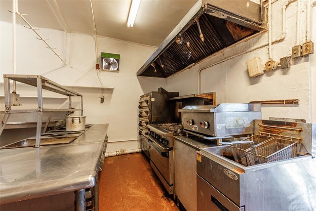 1309 1st St, La Marque, TX 77568 - kitchen with exhaust hood, stainless steel countertops, and stainless steel range