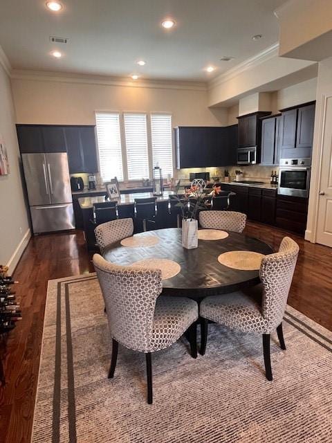 2533 Lamar St, Houston, TX 77003 - dining room with dark wood-style floors, crown molding, and recessed lighting