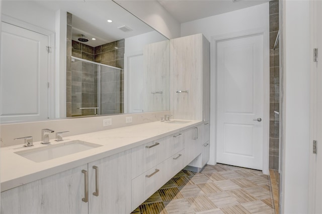 1211 Caroline St Unit 906, Houston, TX 77002 - bathroom featuring double vanity and a stall shower