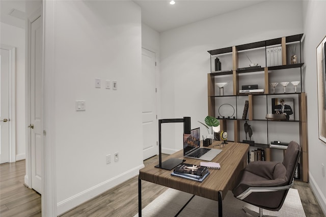 1211 Caroline St Unit 906, Houston, TX 77002 - office area with wood finished floors, baseboards, and recessed lighting