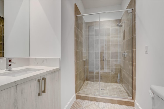1211 Caroline St Unit 906, Houston, TX 77002 - full bath with toilet, vanity, a stall shower, and baseboards