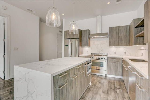 1211 Caroline St Unit 906, Houston, TX 77002 - kitchen with modern cabinets, stainless steel appliances, a sink, wall chimney exhaust hood, and a center island