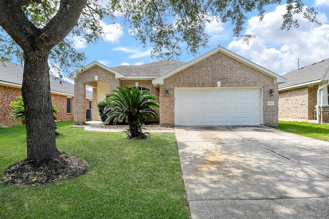 1907 Meadow Edge Ln, Spring, TX 77388 - single story home featuring driveway, a front yard, an attached garage, and brick siding