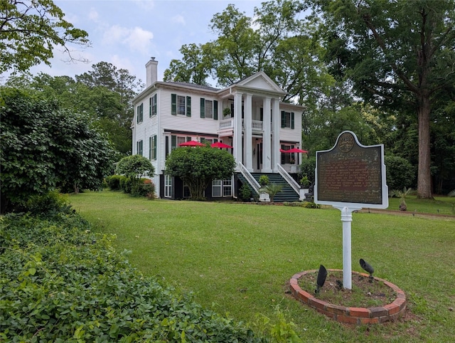 301 S Alexander Ave, Washington, GA 30673 - greek revival house featuring stairs, a chimney, and a front yard