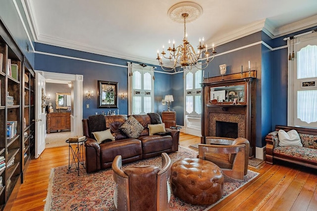 301 S Alexander Ave, Washington, GA 30673 - living area featuring a chandelier, wood-type flooring, crown molding, and a fireplace