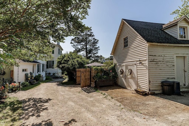 301 S Alexander Ave, Washington, GA 30673 - view of property exterior featuring roof with shingles