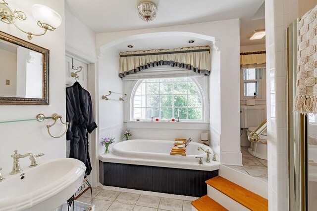 301 S Alexander Ave, Washington, GA 30673 - bathroom featuring a sink and a bath