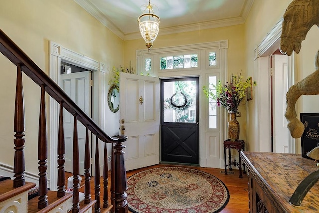 301 S Alexander Ave, Washington, GA 30673 - entryway featuring light wood-type flooring, crown molding, stairway, and a chandelier