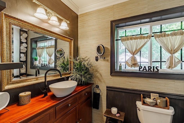 301 S Alexander Ave, Washington, GA 30673 - bathroom featuring toilet, healthy amount of natural light, vanity, crown molding, and wallpapered walls