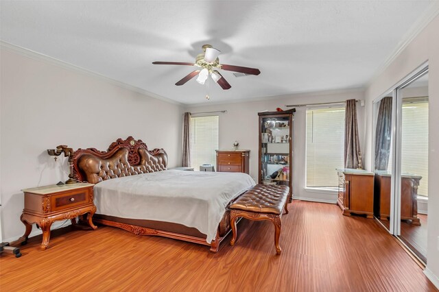 3714 Green Fields Dr, Sugar Land, TX 77479 - bedroom with light wood-style flooring, ornamental molding, ceiling fan, and baseboards