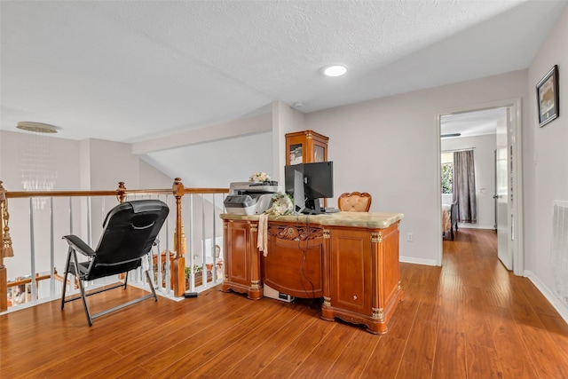 3714 Green Fields Dr, Sugar Land, TX 77479 - office space featuring light wood-style floors, baseboards, and a textured ceiling