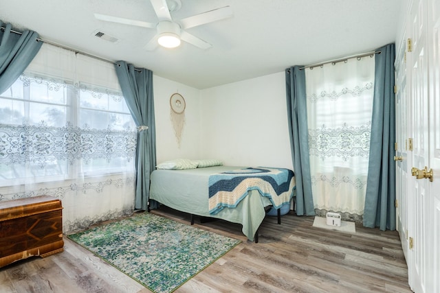 117 Tuna St, Galveston, TX 77550 - bedroom featuring wood finished floors and ceiling fan