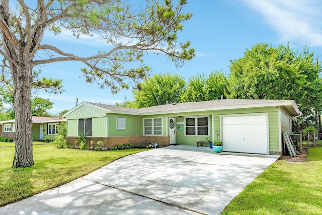 117 Tuna St, Galveston, TX 77550 - single story home featuring a garage, concrete driveway, a front yard, and brick siding