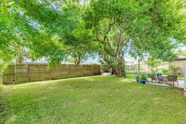 117 Tuna St, Galveston, TX 77550 - fenced backyard featuring a patio