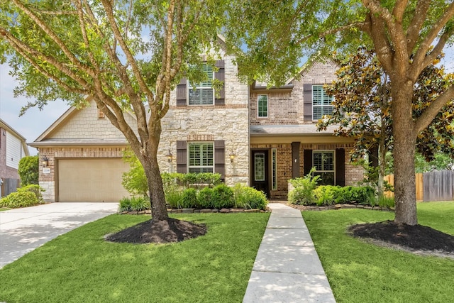 27208 Adrian Hills Ln, Spring, TX 77386 - traditional home with concrete driveway, brick siding, an attached garage, and stone siding