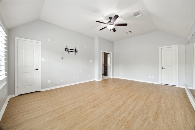 27208 Adrian Hills Ln, Spring, TX 77386 - spare room with lofted ceiling, a ceiling fan, light wood-style flooring, and baseboards