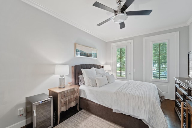 1807 Ashland St, Houston, TX 77008 - bedroom featuring ornamental molding, dark wood-style floors, a ceiling fan, and baseboards