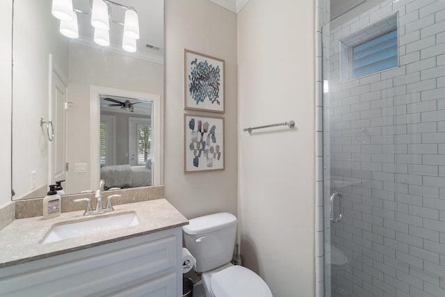 1807 Ashland St, Houston, TX 77008 - ensuite bathroom with vanity, a stall shower, toilet, ceiling fan, and ornamental molding