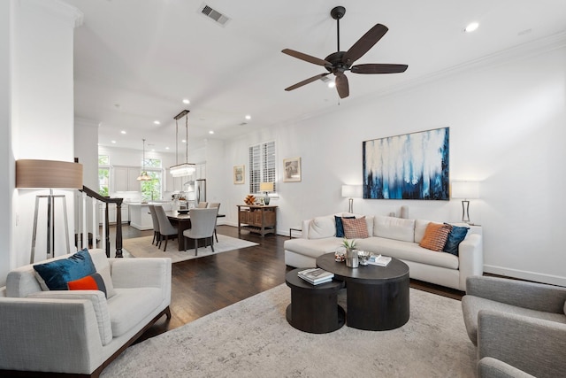 1807 Ashland St, Houston, TX 77008 - living area with dark wood finished floors, recessed lighting, ceiling fan, and crown molding